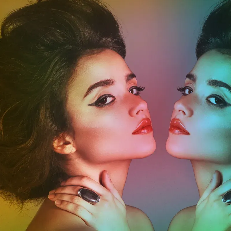 Elegant brunette woman with long dark hair and classic makeup style