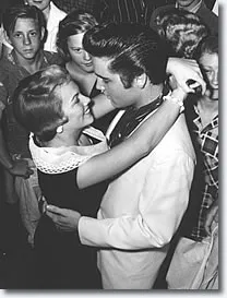 Elvis Presley and Anita Wood sharing a tender moment before his departure for the West Coast tour