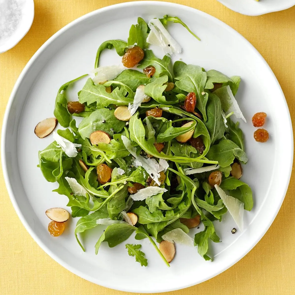 Fresh arugula salad with shaved Parmesan cheese