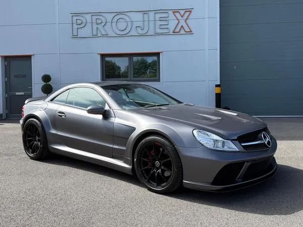 Mercedes-Benz SL500 convertible with roof down on scenic road