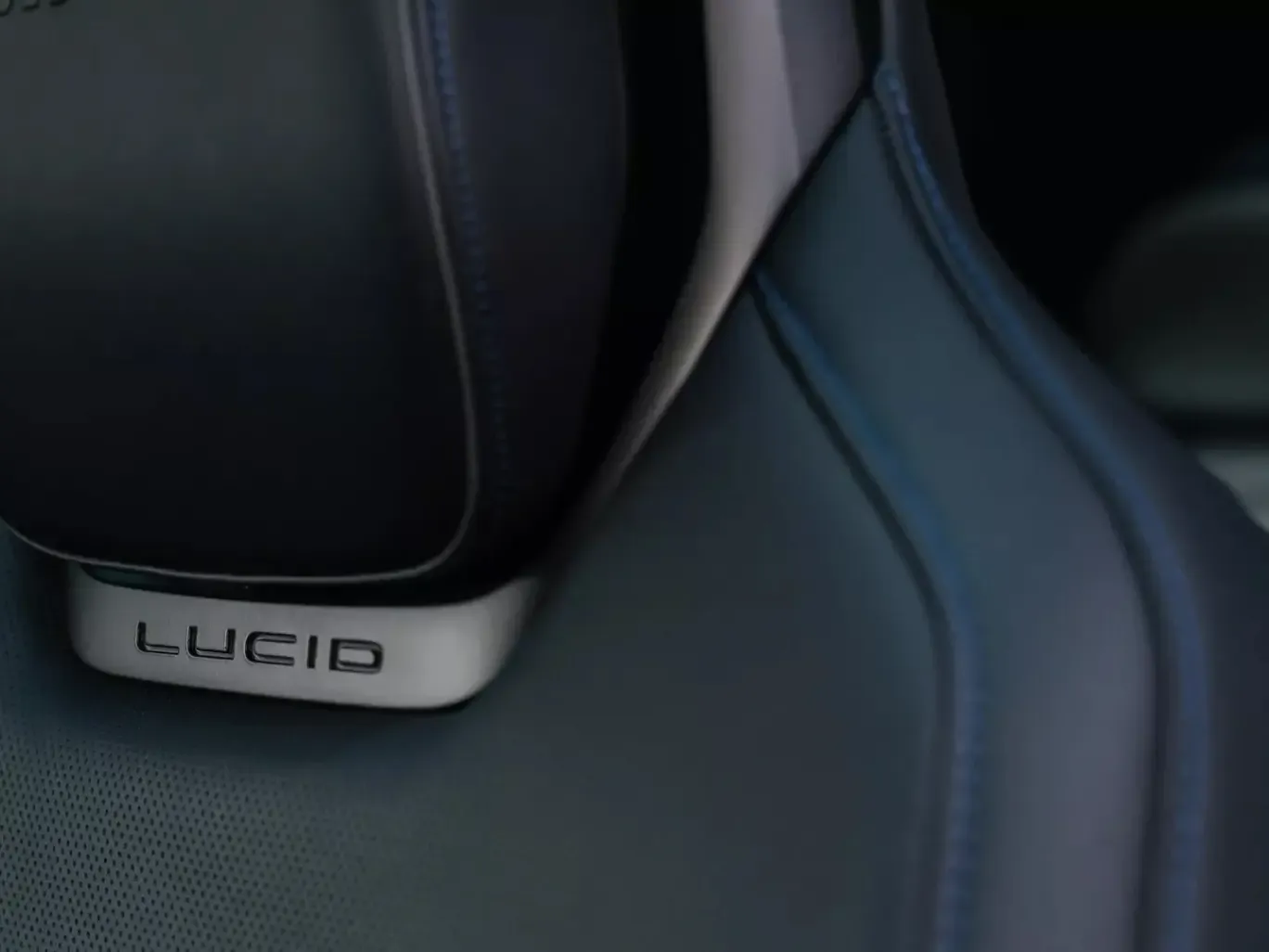 The Lucid Air Sapphire's steering wheel and dashboard, featuring Carbon Oak veneers and Alcantara trim