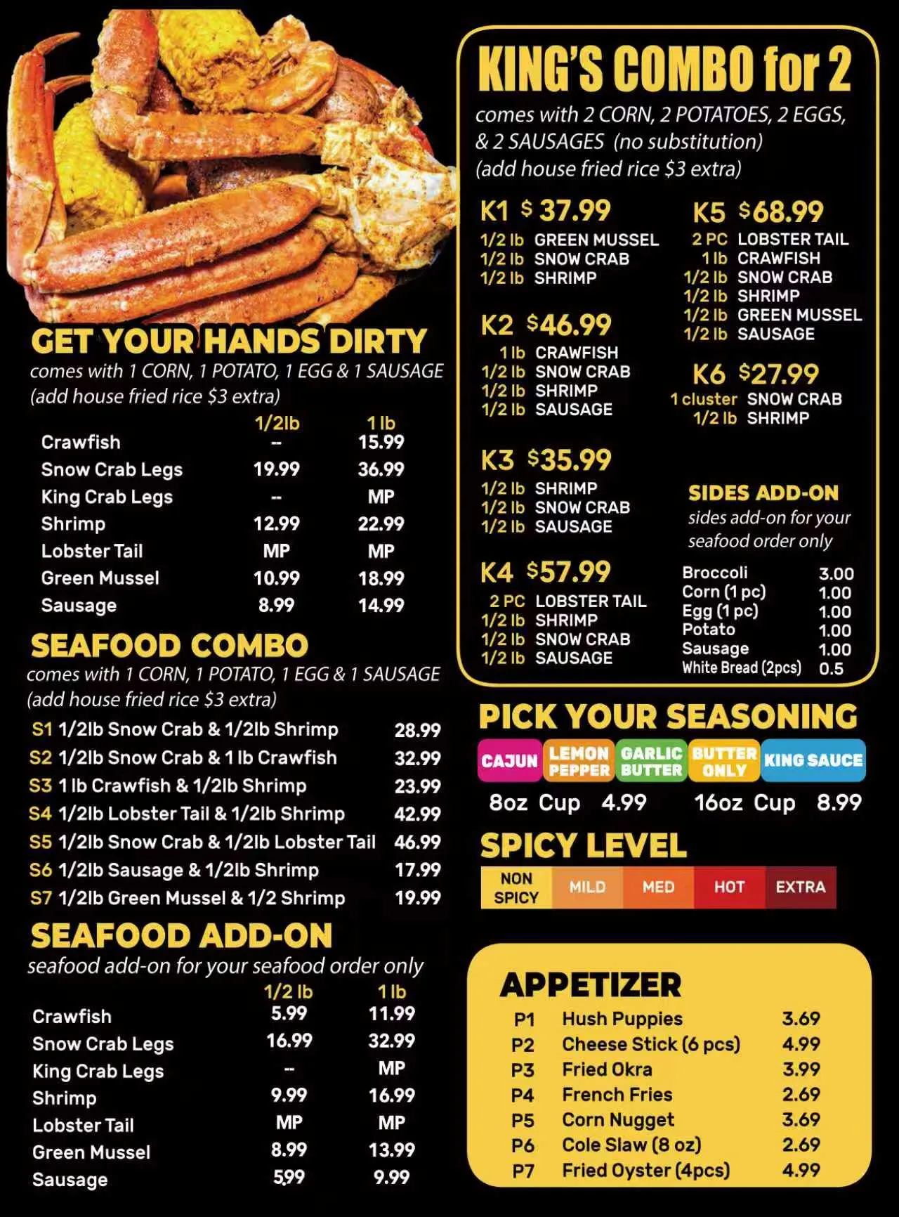 Assorted Cajun seafood platter with lobster, crab legs, and sides arranged for a shared meal experience