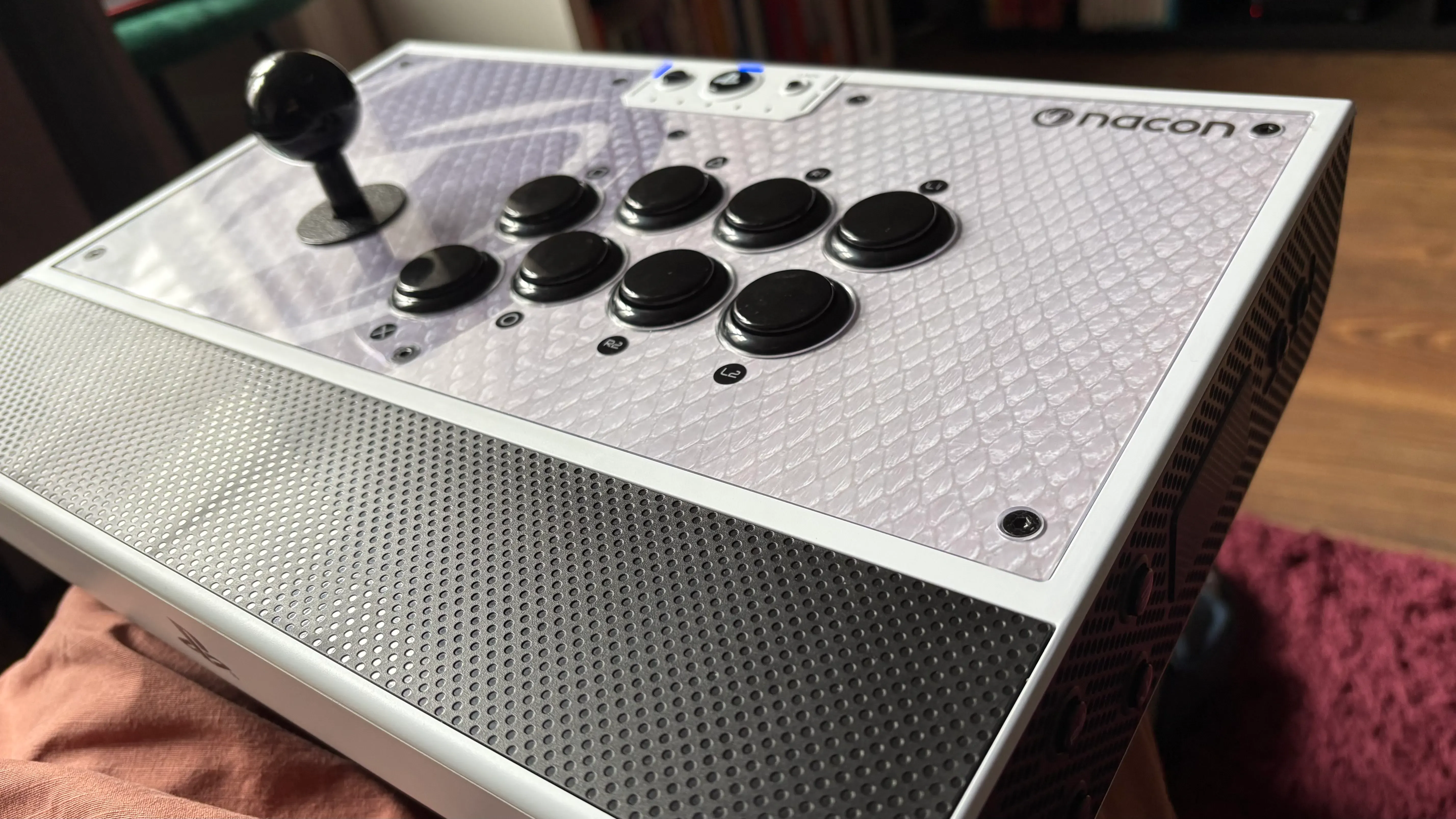 Heavy-duty fight stick with textured palm rest and customizable faceplate