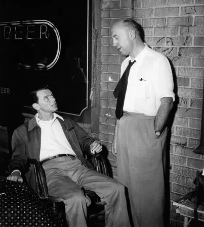 Frank Sinatra and director Otto Preminger on the set of The Man with the Golden Arm