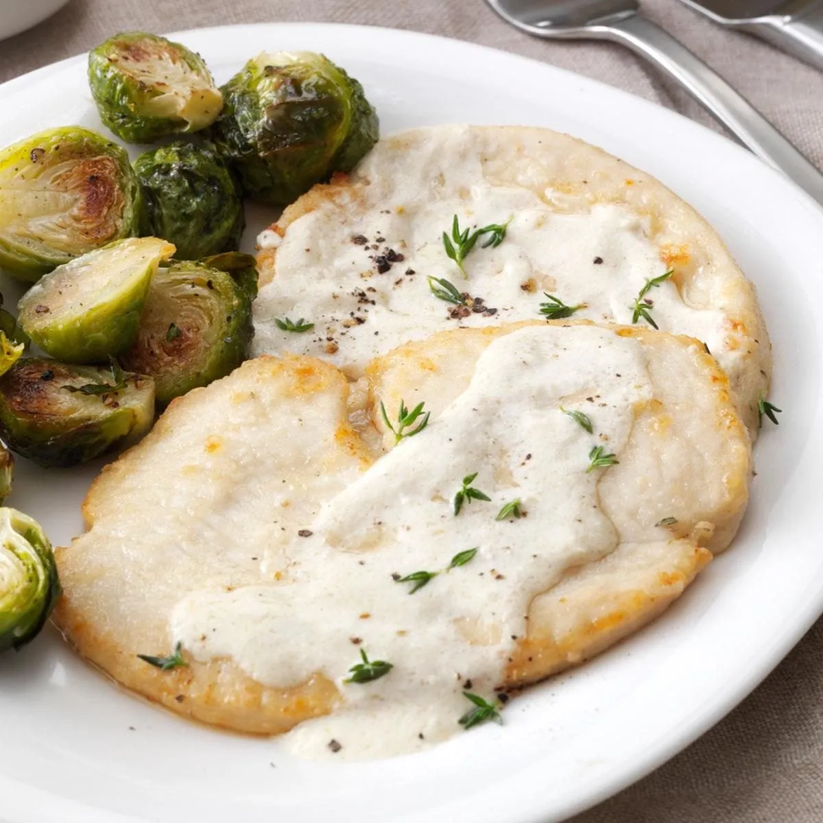 Veal Milanese served with lemon wedges