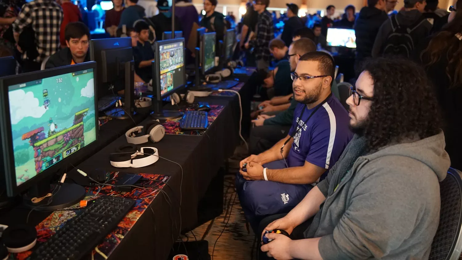 Group of people playing online games together in a gaming setup