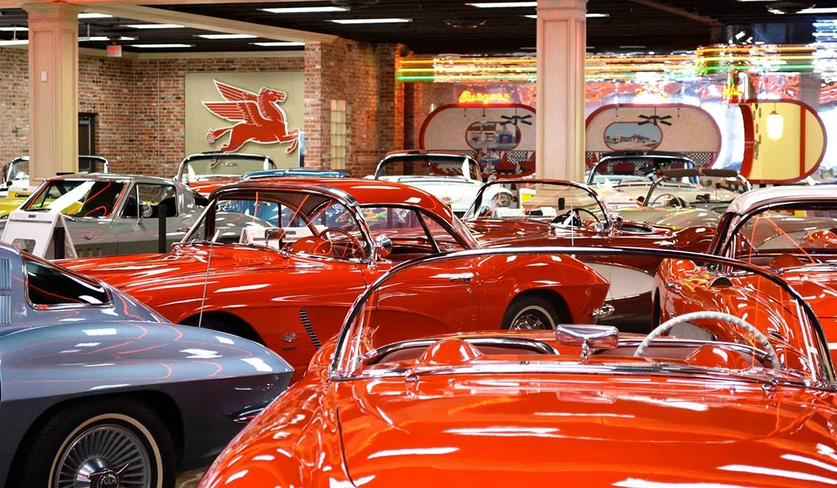 Rows of classic American cars on display inside the Horton Classic Car Museum in Nocona Texas