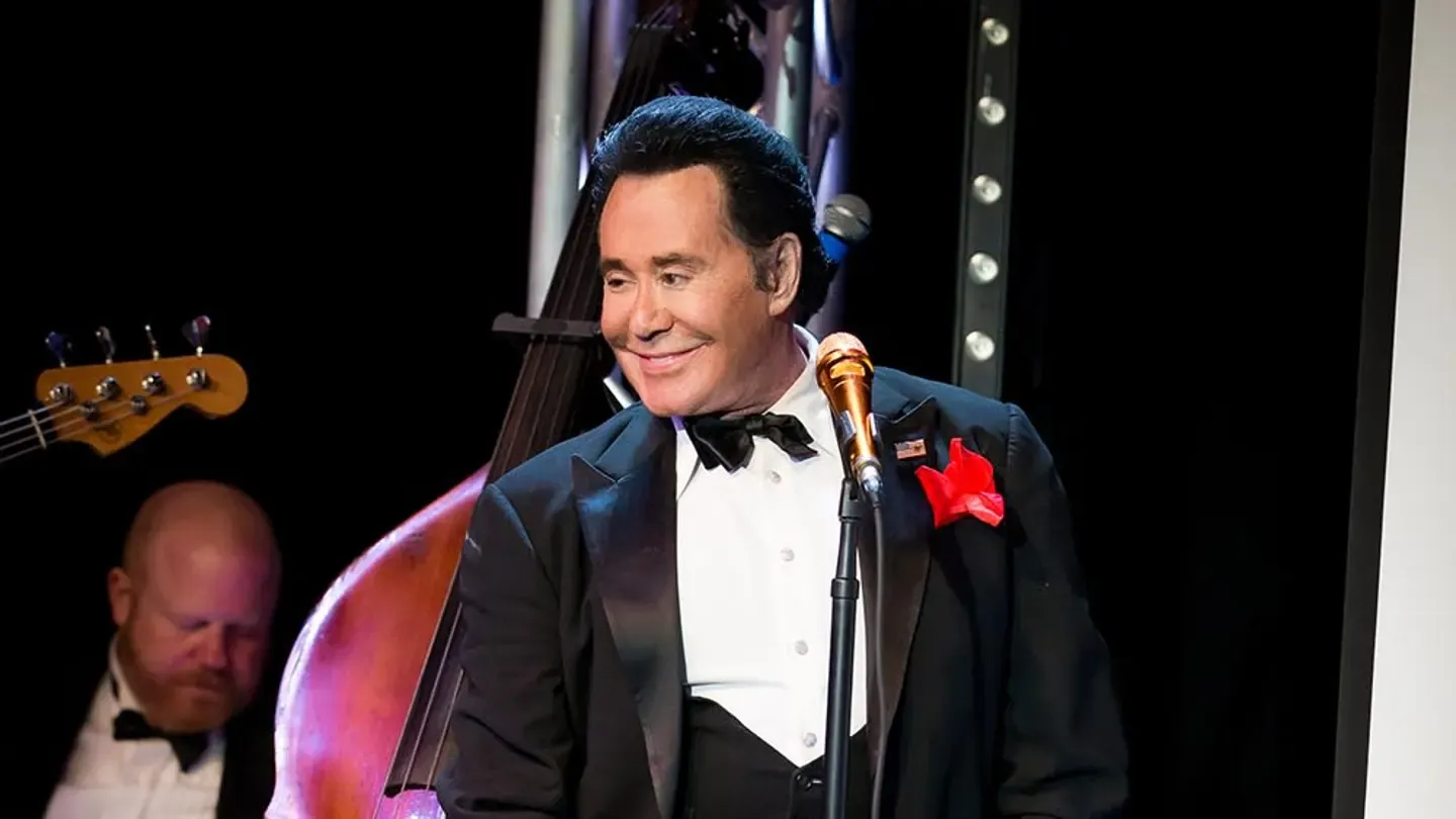 Wayne Newton with members of the Rat Pack, capturing the camaraderie of a bygone era