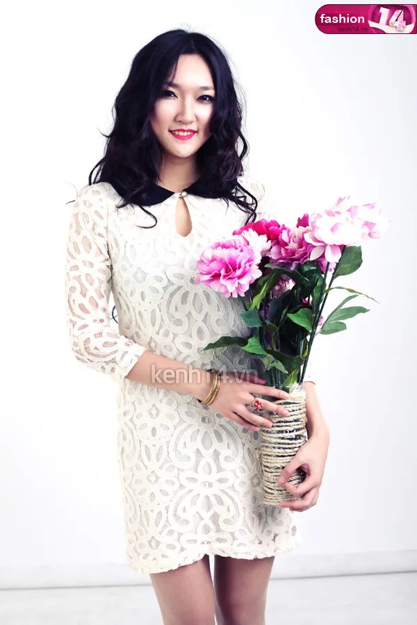 Close-up of model in a styled cocktail dress with polished hair and makeup for a Women's Day editorial