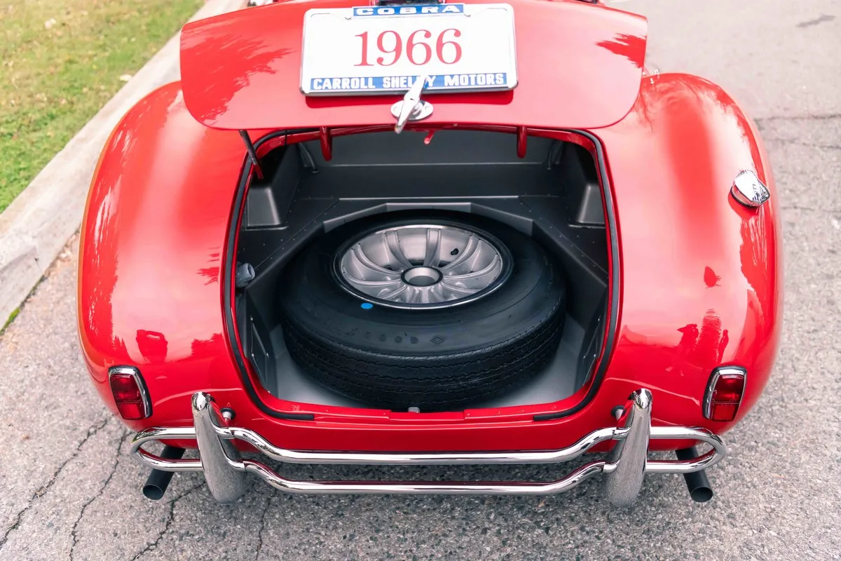 Rear quarter view of 1966 Shelby 427 Cobra showing compact racing stance and polished finish