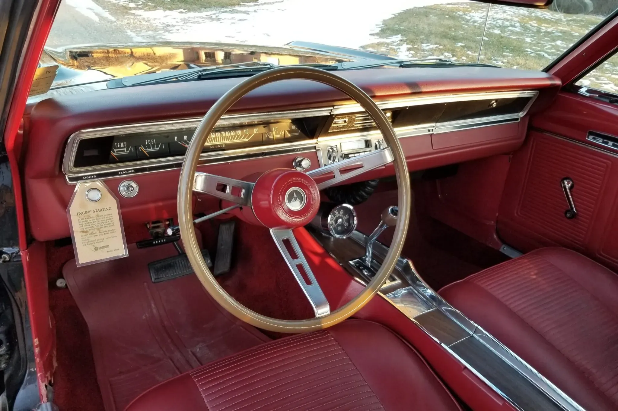 Red vinyl bucket seat interior of 1969 Dodge Dart GTS 440