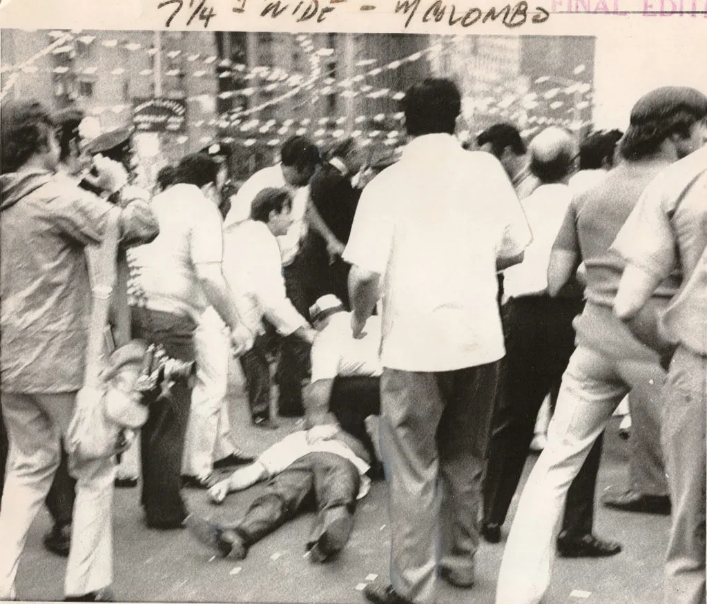 A man attends to Joseph Colombo, who is sprawled on the ground after being shot three times at an Italian-American Civil Rights League rally in New York in 1971. Courtesy of Christian Cipollini.