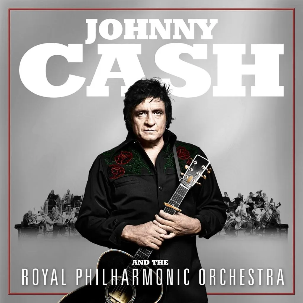 Johnny Cash performing with orchestral backing, dressed in black