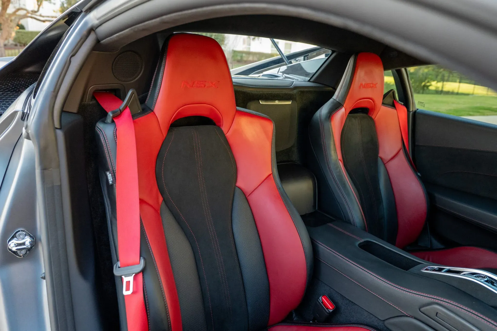 Interior of 2022 Acura NSX Type S showing red/black leather seats and digital cockpit