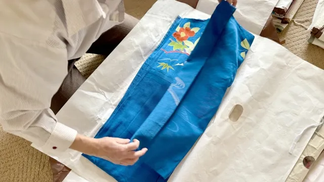 A beautifully crafted kimono laid out for measurement