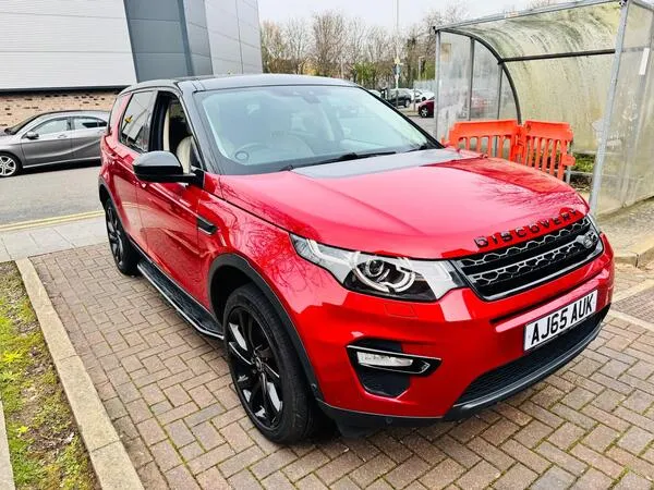 Land Rover Discovery Sport driving through woodland trail showcasing versatility