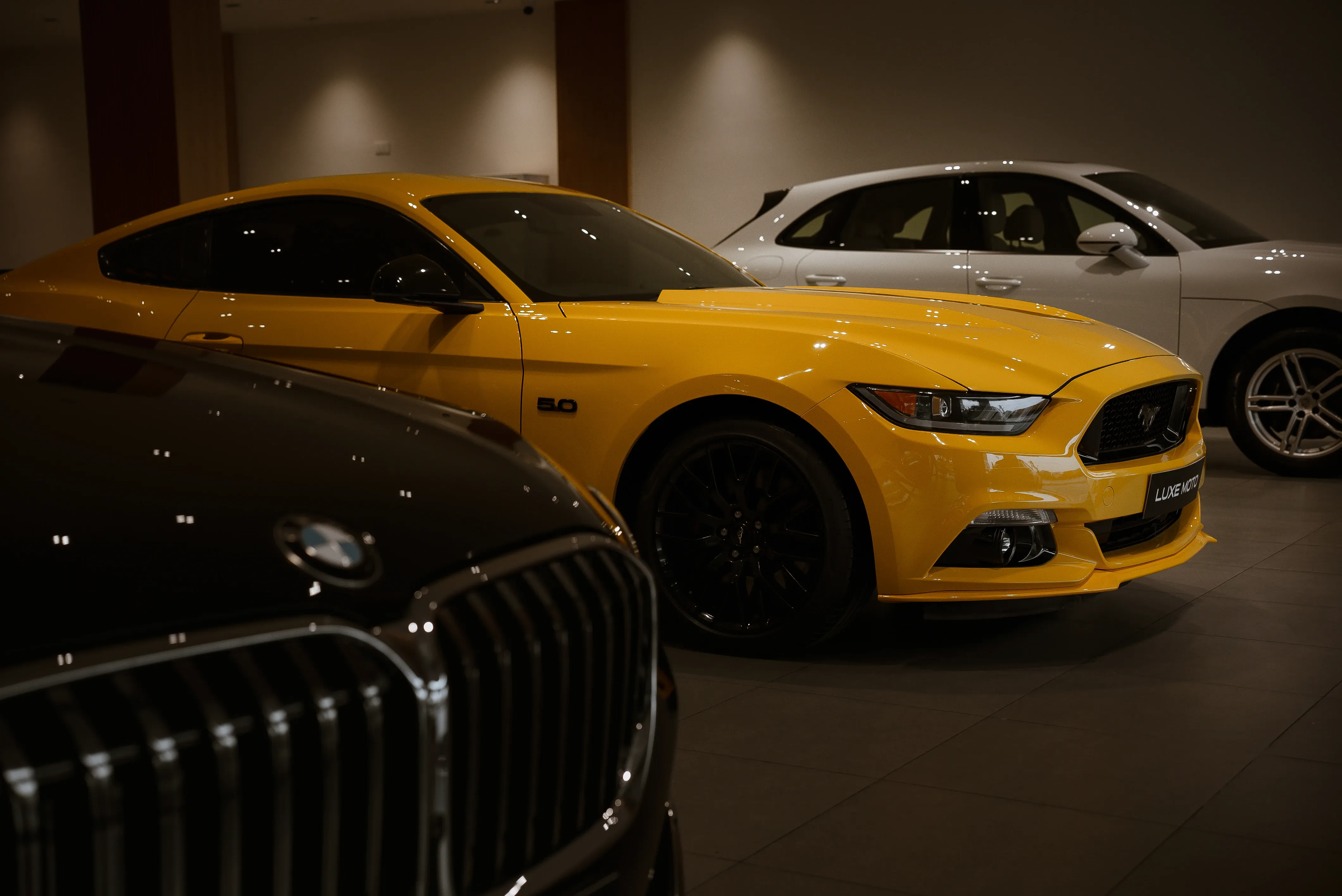 Luxe Moto garage showcasing premium pre-owned luxury cars