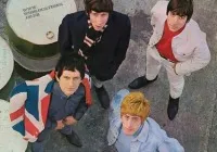The Beatles performing during their early years in the 1960s