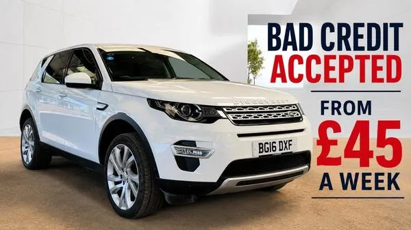 Land Rover Discovery Sport parked on scenic countryside road