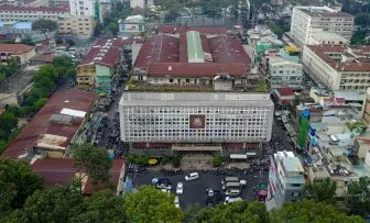 A bus traveling through Ho Chi Minh City with scenic views