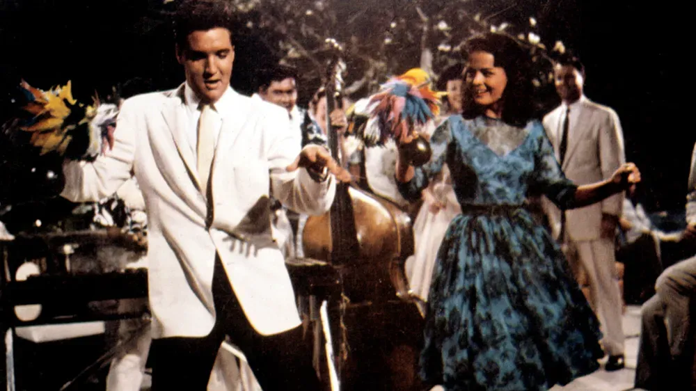 Elvis Presley performing in a tropical musical comedy set in Hawaii