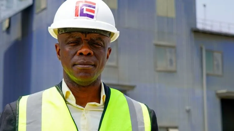 Workers constructing infrastructure in Liberia, supporting local cement production and economic development