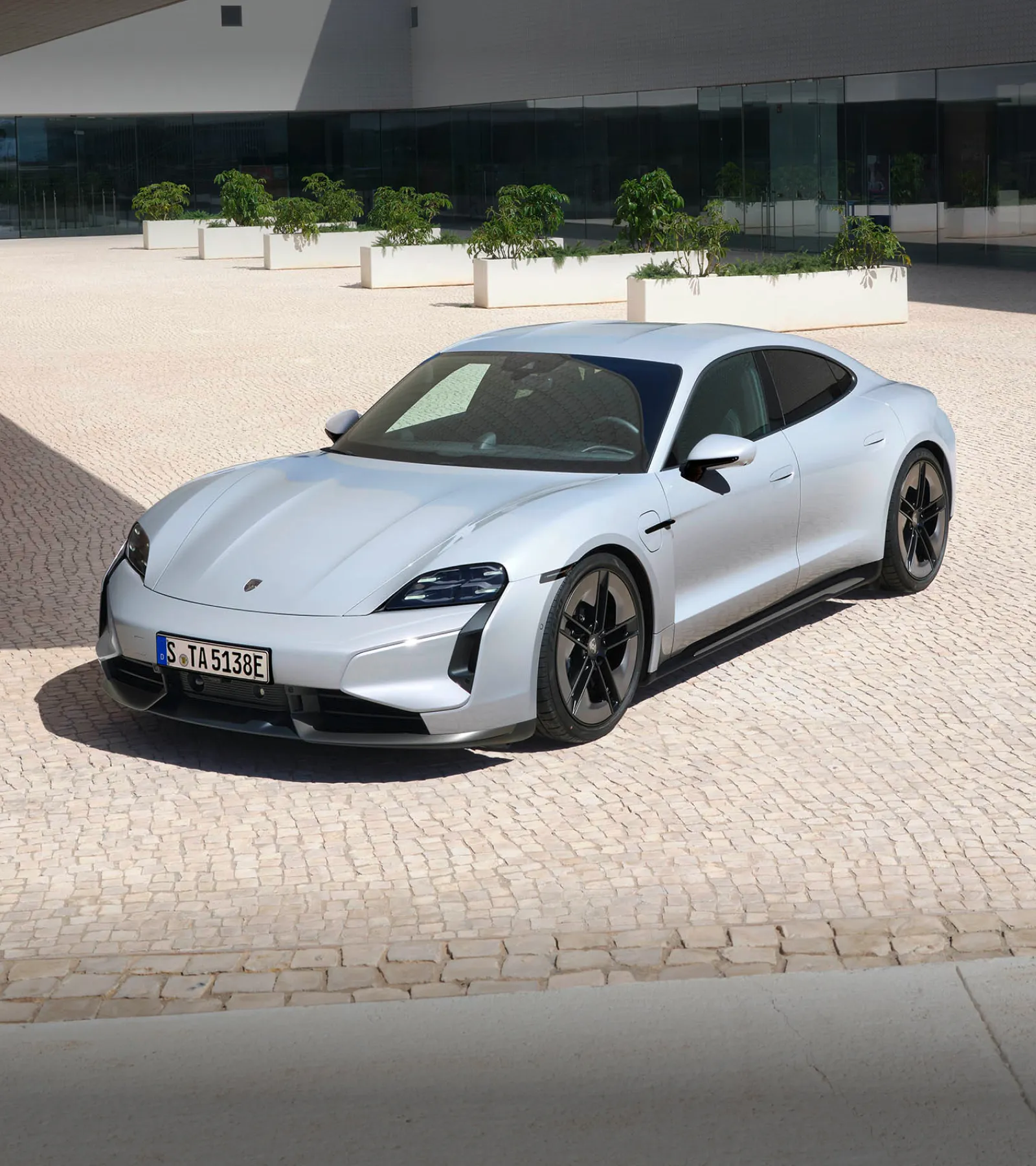 Porsche Taycan electric sports sedan charging and display presentation