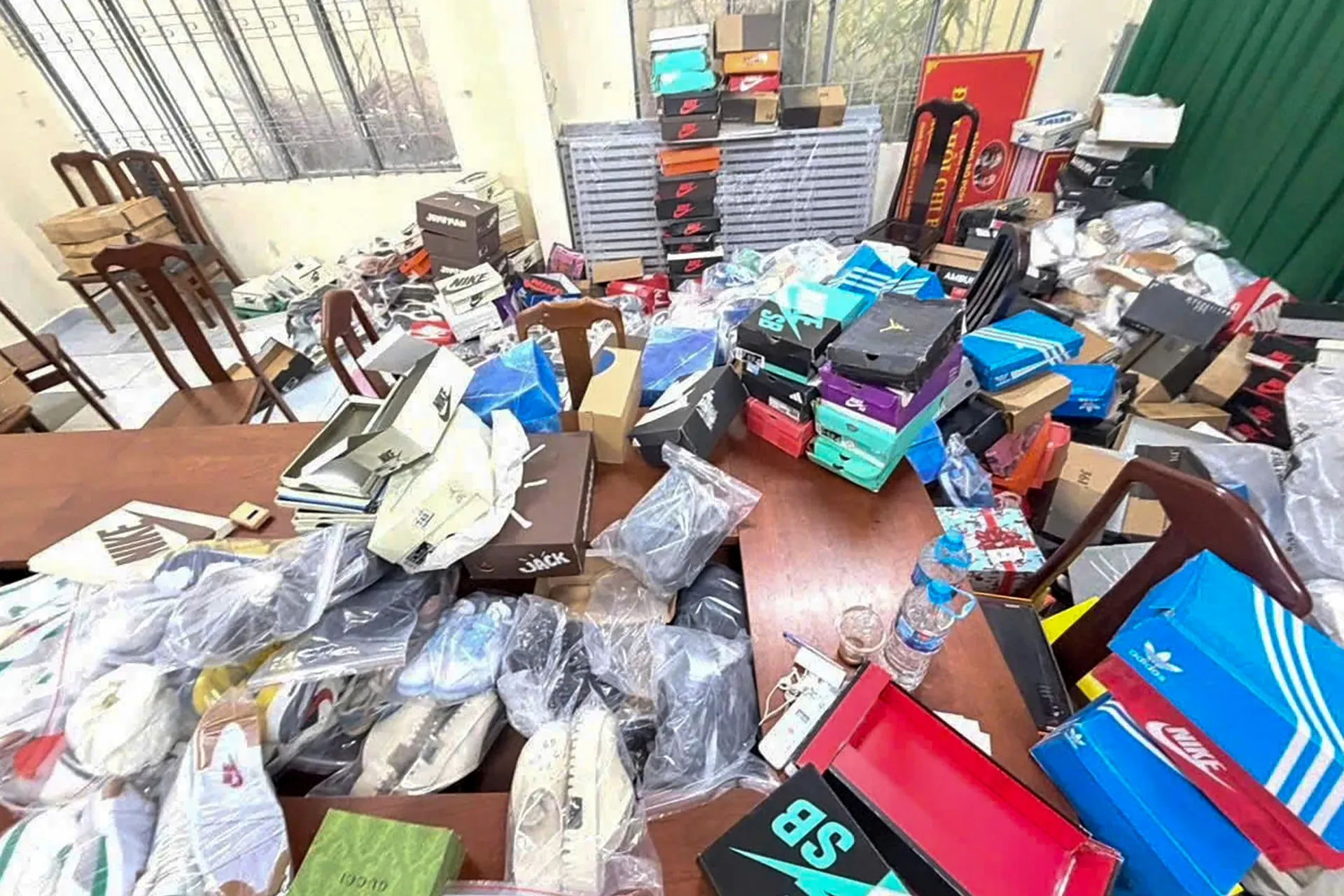 Police seize large stock of counterfeit Adidas and Gucci shoes