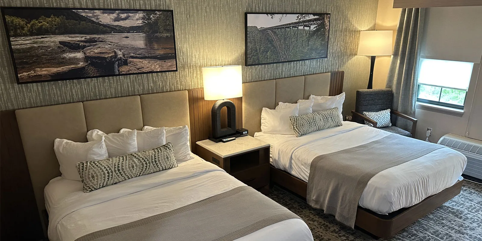 Deluxe Double Queen room with modern décor and twin beds