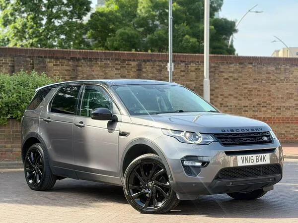 Interior cabin view of Land Rover Discovery Sport showing leather seats and infotainment system