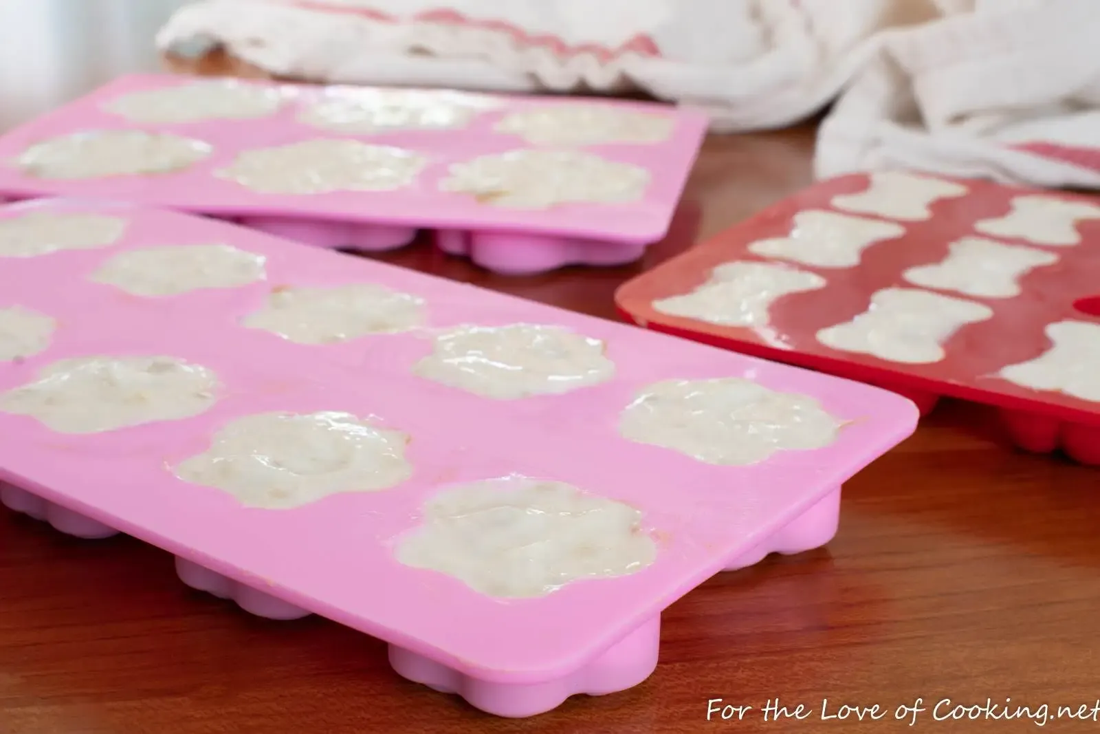 Homemade frozen dog snacks arranged for portion control and digestive-friendly feeding