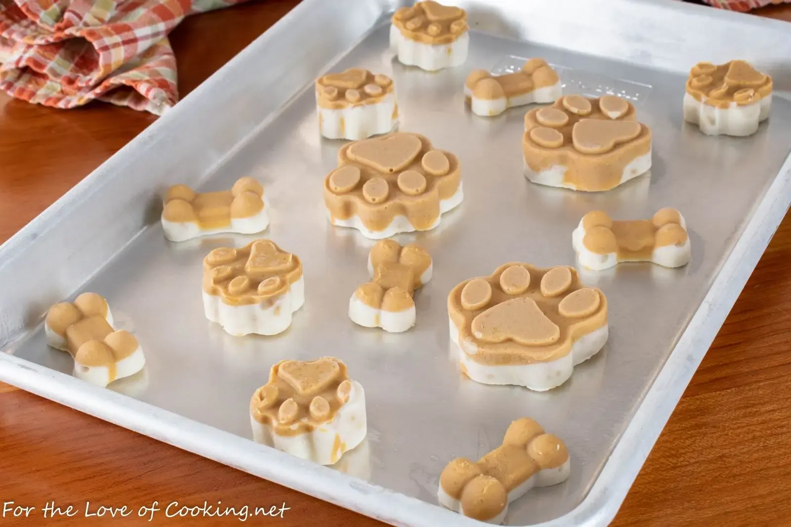 Peanut butter and banana frozen treats displayed as enrichment snacks for dogs on balanced diets