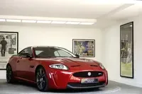 Jaguar XK parked at a concours-style event illustrating market for classic British cars