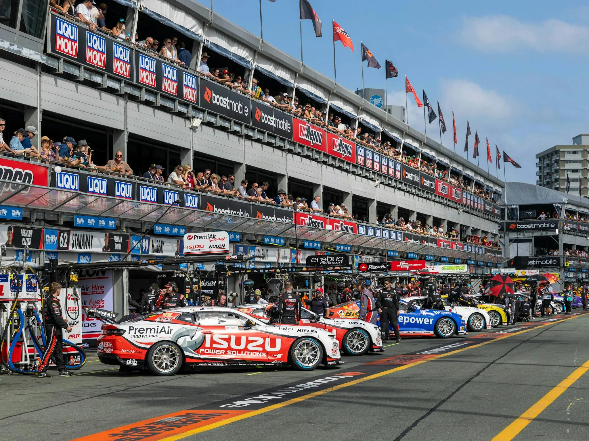 High-speed Supercars racing through Surfers Paradise street circuit during Gold Coast 500