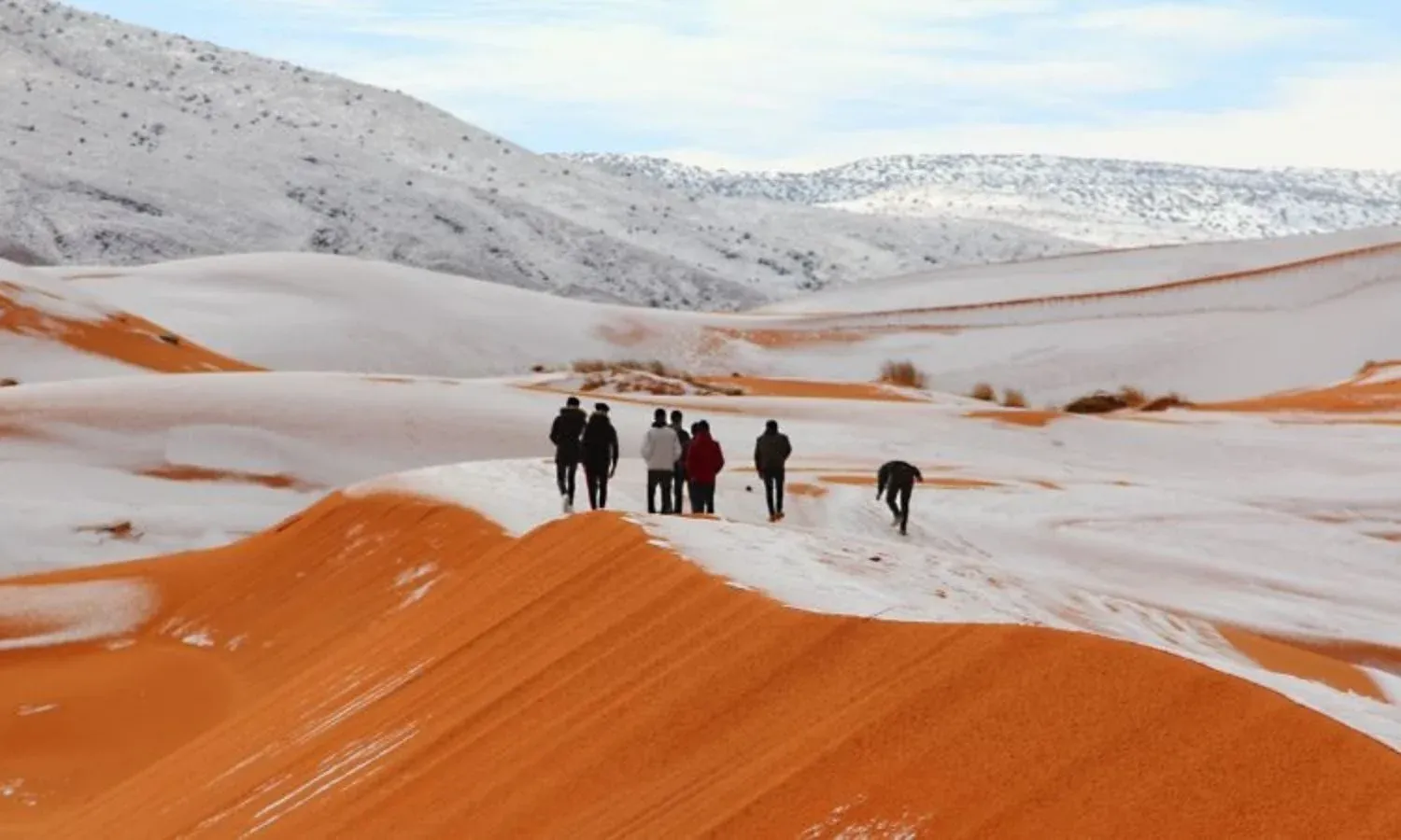 Rare snowfall covering desert sand dunes in North Africa during winter 2018