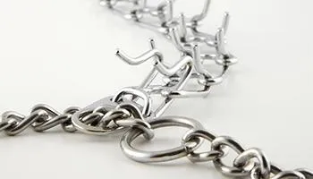 Metal prong collar with sharp prongs designed to press into a dog's neck