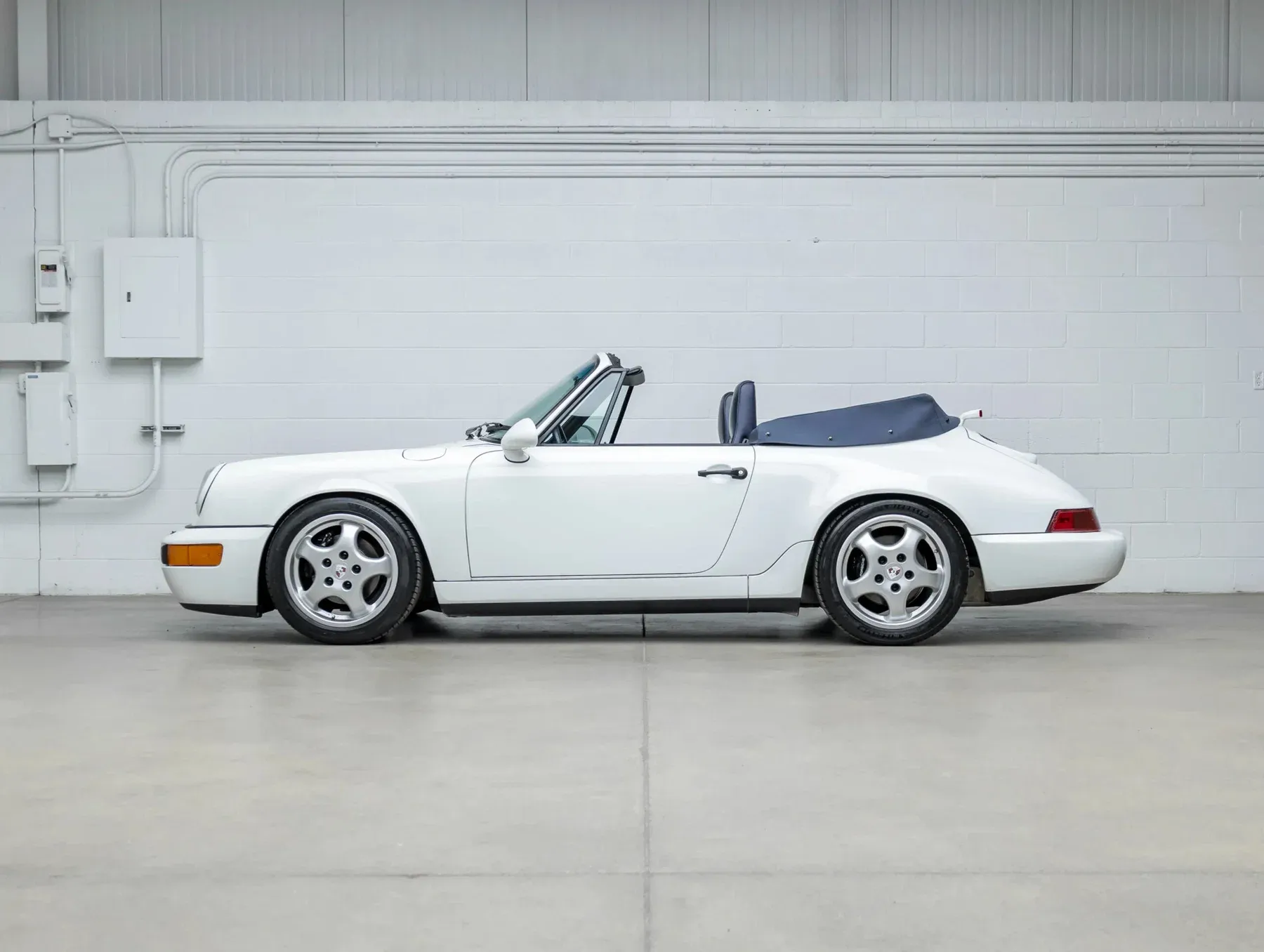 Classic Porsche 964 Carrera 4 in pristine condition at listing presentation