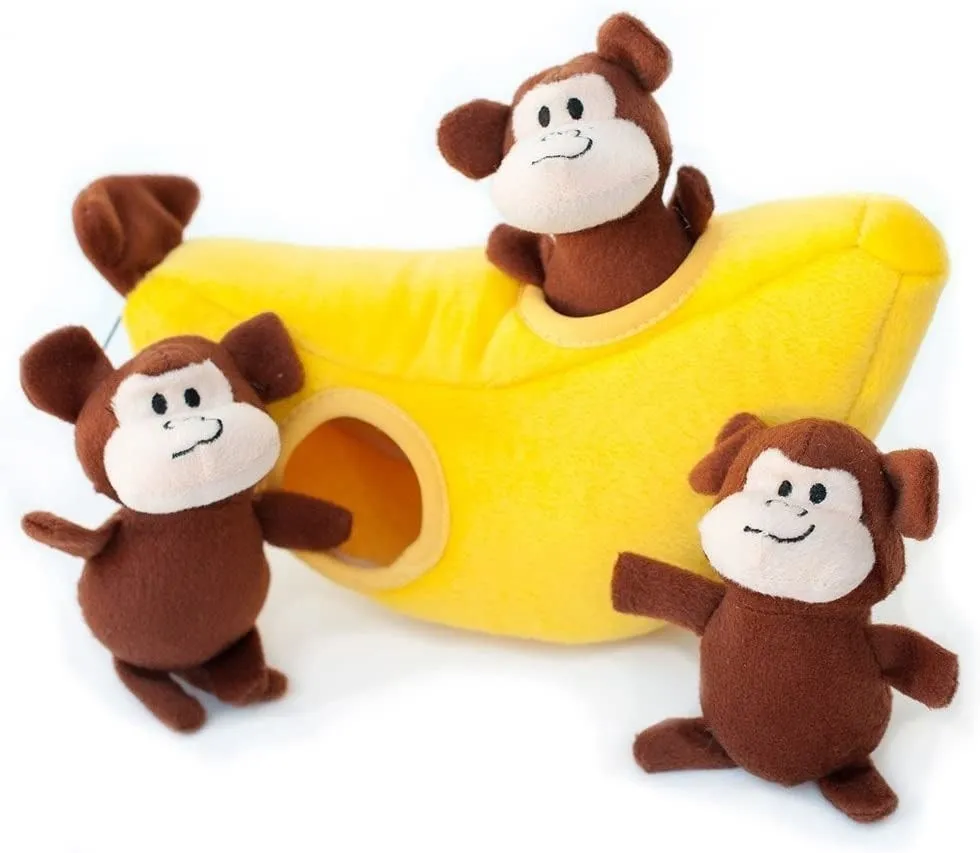 Three plush monkey dog toys and a banana that they all fit into