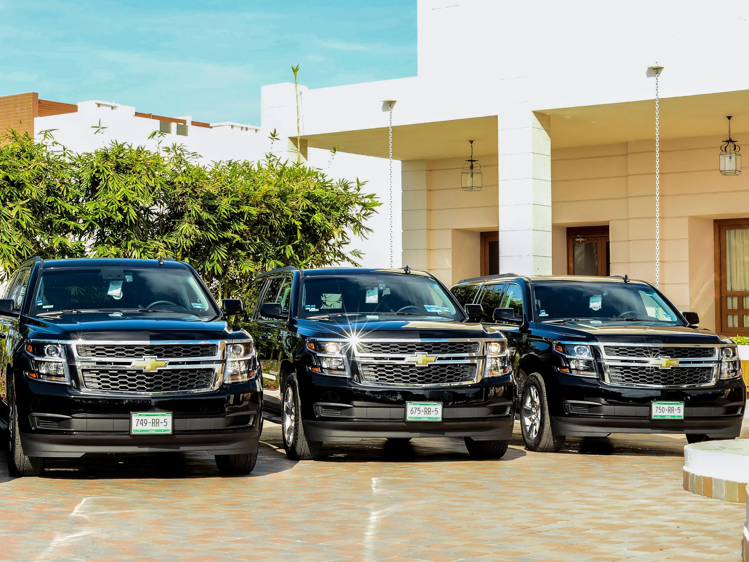 Luxury airport transfer SUV arriving at Cancun Airport for Excellence Playa Mujeres guests