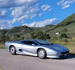 Front three-quarter view of a Jaguar XJ220 showing aerodynamic body design and low stance