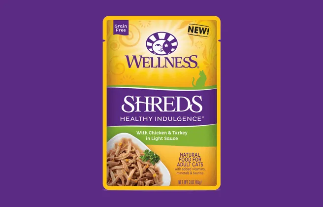 Wellness Healthy Indulgence wet cat food packaging highlighting shredded meat texture
