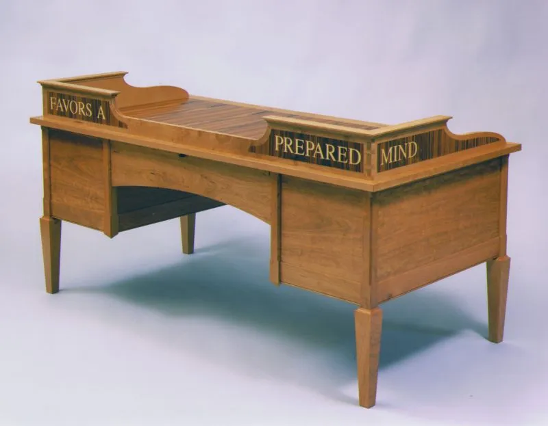 Woodshop workbench with hand tools, wood shavings, and a measuring tape