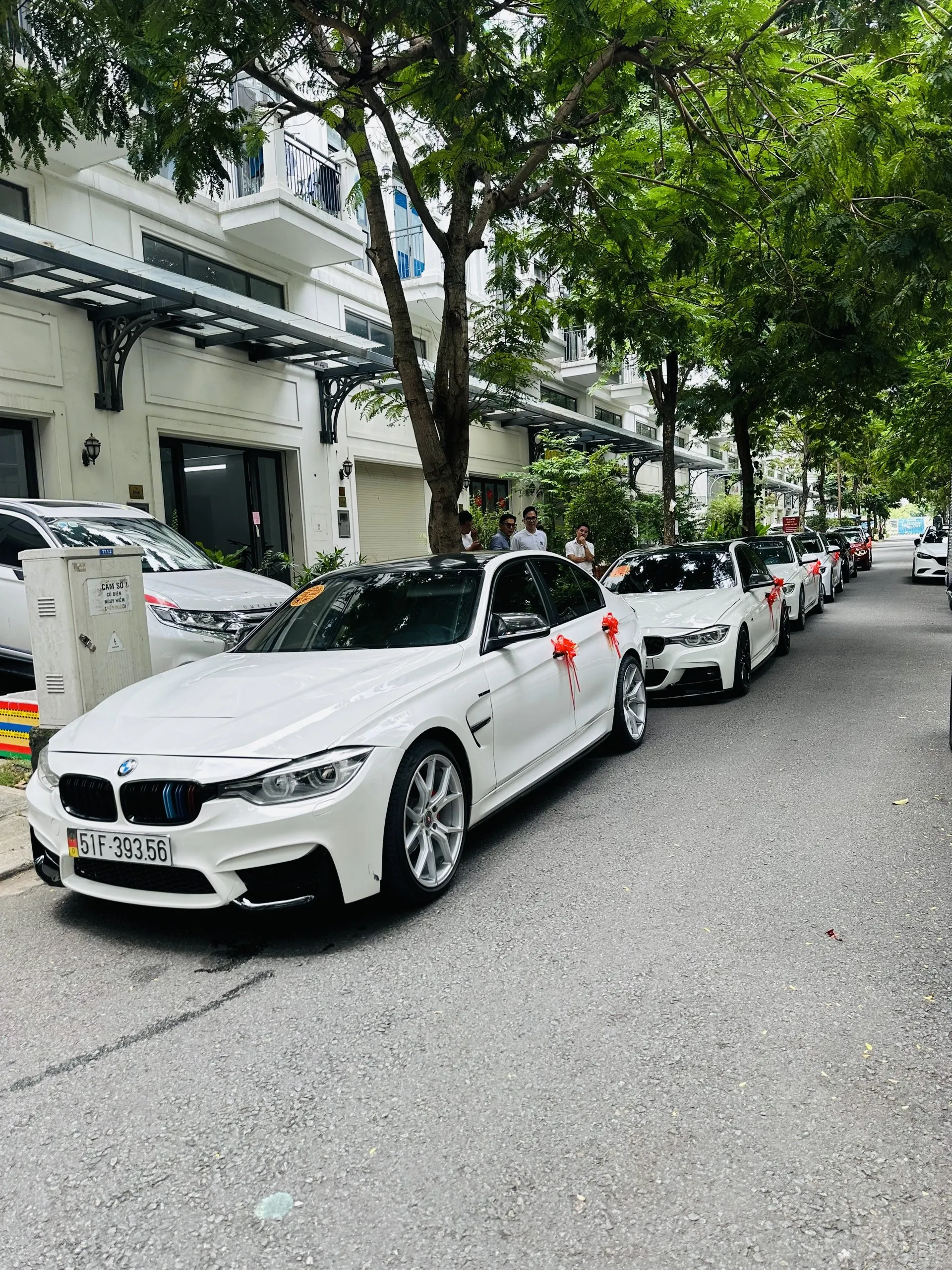 BMW and Porsche luxury wedding cars lined up in Ho Chi Minh City