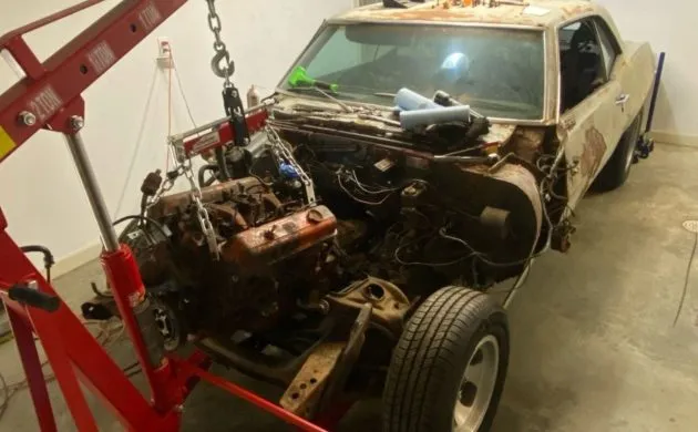 1969 Chevrolet Camaro body mounted on a rotisserie during restoration