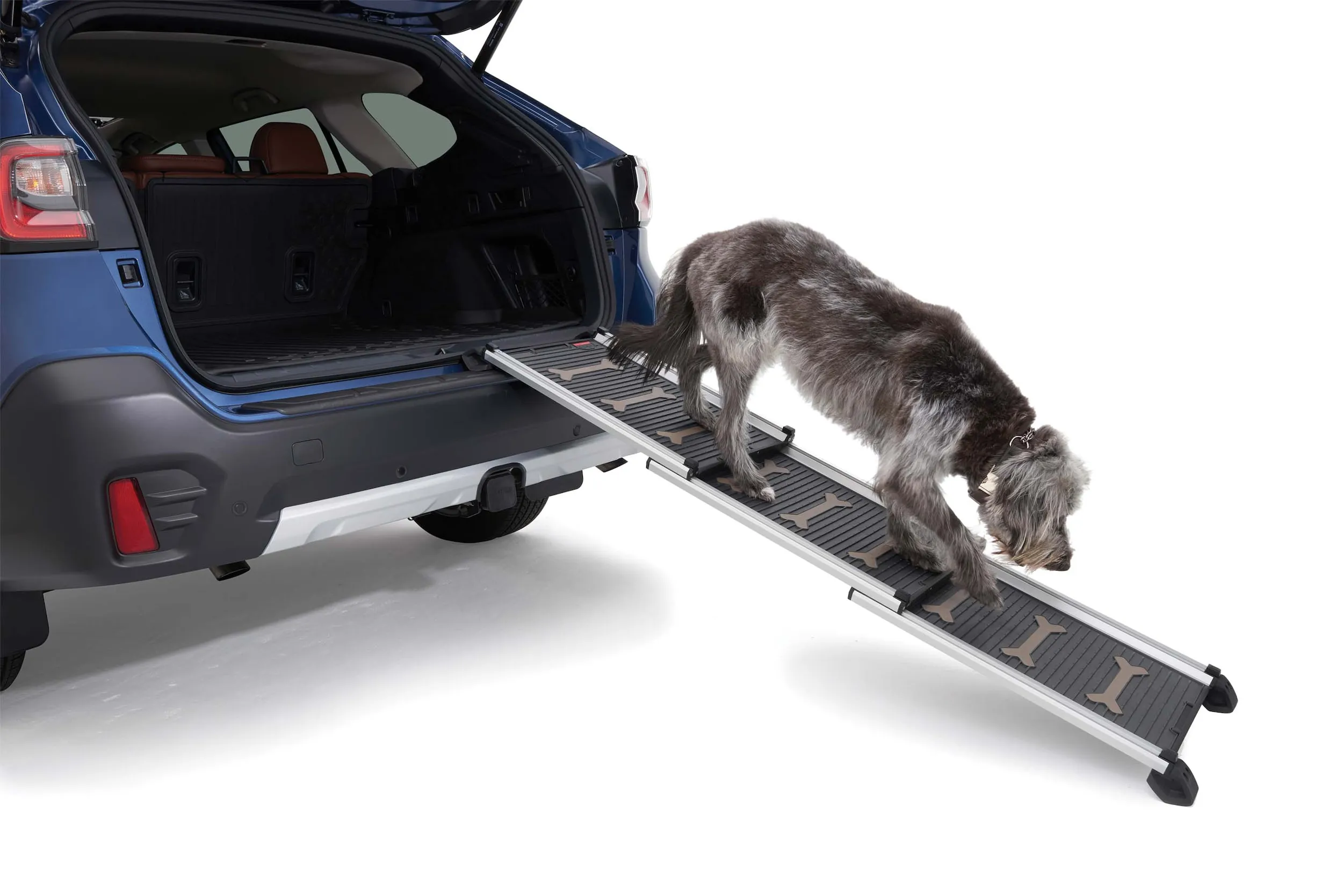 Aluminum telescoping pet ramp extended from a vehicle's rear cargo area