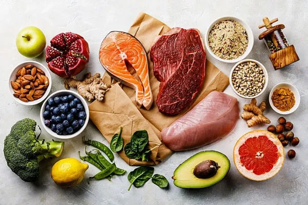 Colorful bowl of fresh vegetables and grains arranged for a balanced healthy meal