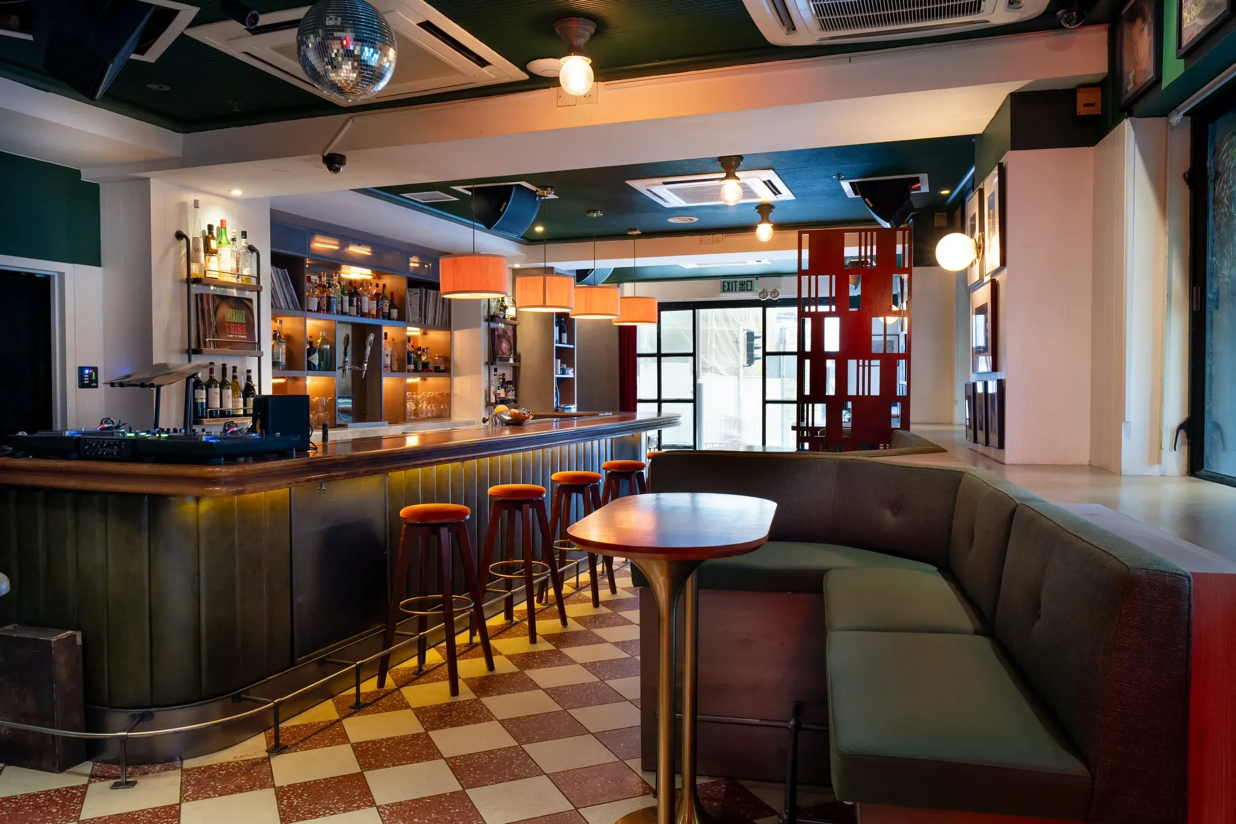 Interior of Frank's record lounge with vinyl collection and warm ambient lighting