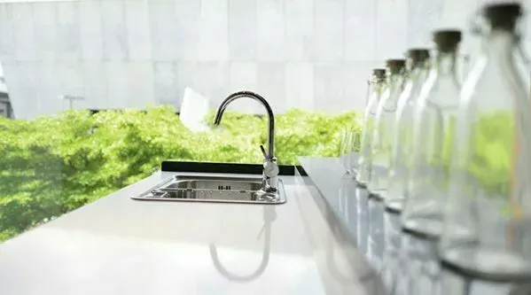 Modern kitchen with elegant sink and faucet installation