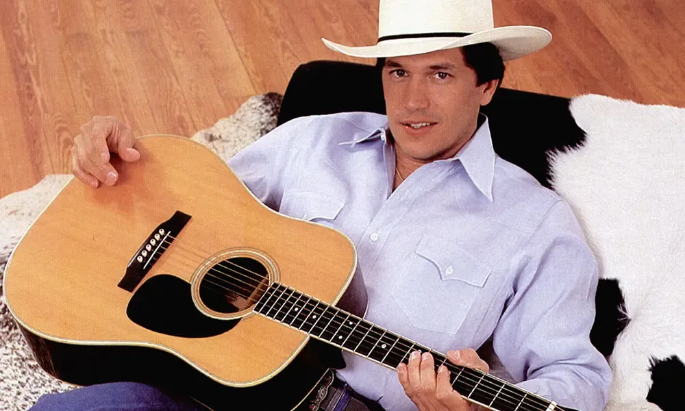 George Strait performing on stage during his legendary country music career