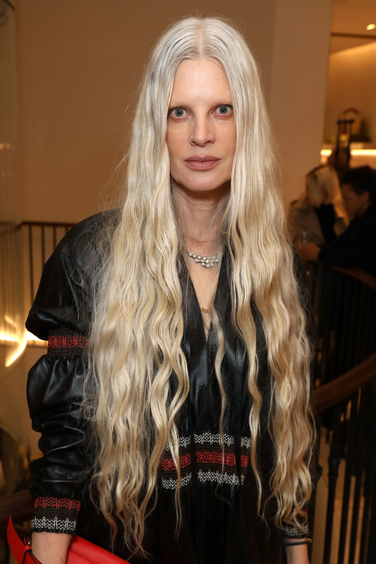 Kristen McMenamy with a bright platinum hair shade